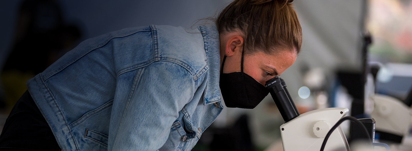 Student with microscope