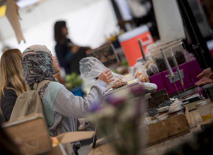 UC Sand Diego student at farmers market.